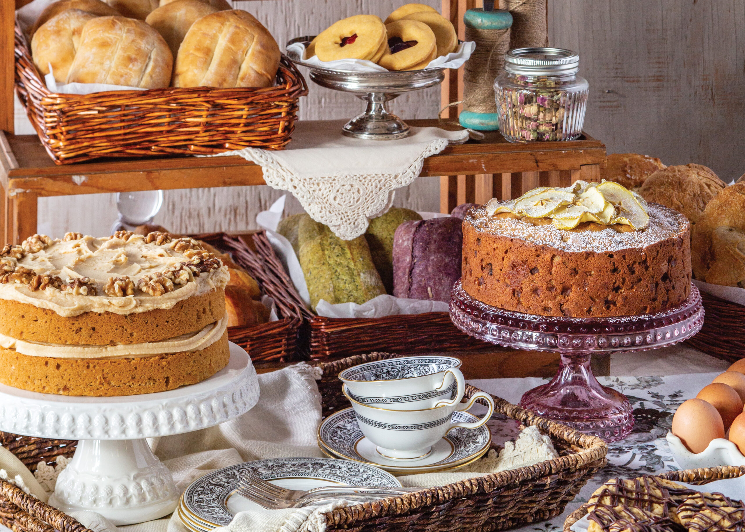 Assortment of breads, cakes, and cookies on a table