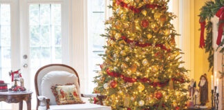 Christmas tree in living room with presents and decorations