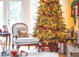 Christmas tree in living room with presents and decorations