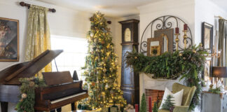 Living room with piano and Christmas greenery