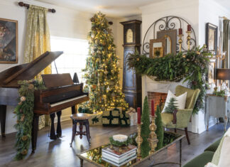 Living room with piano and Christmas greenery