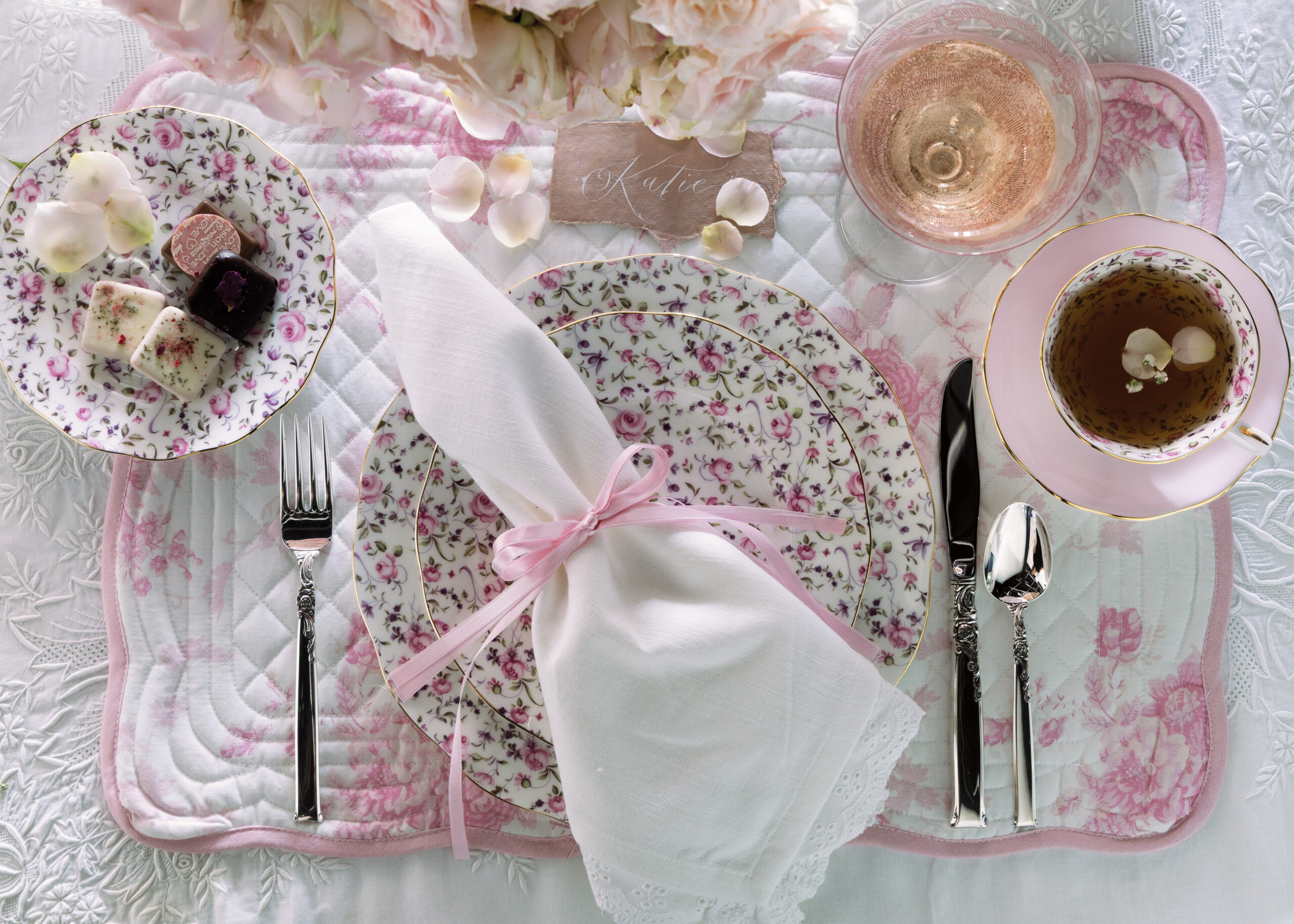 Rose-themed place setting with tea