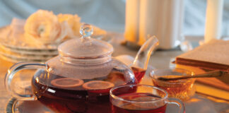 Hibiscus-Ginger Tea in a clear teapot and in a clear teacup
