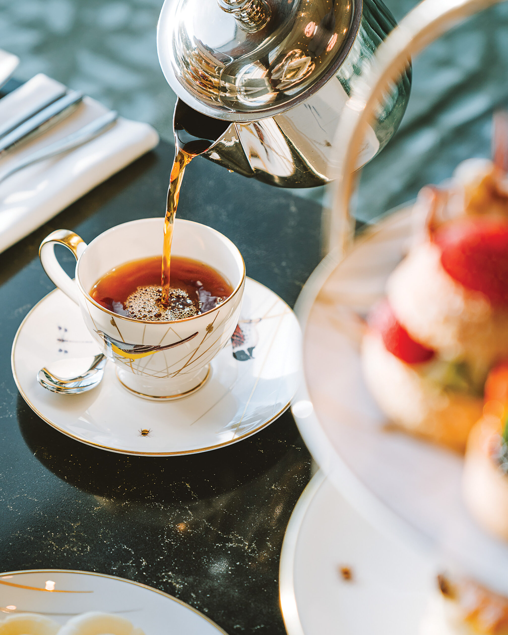 Tea being poured into a cup