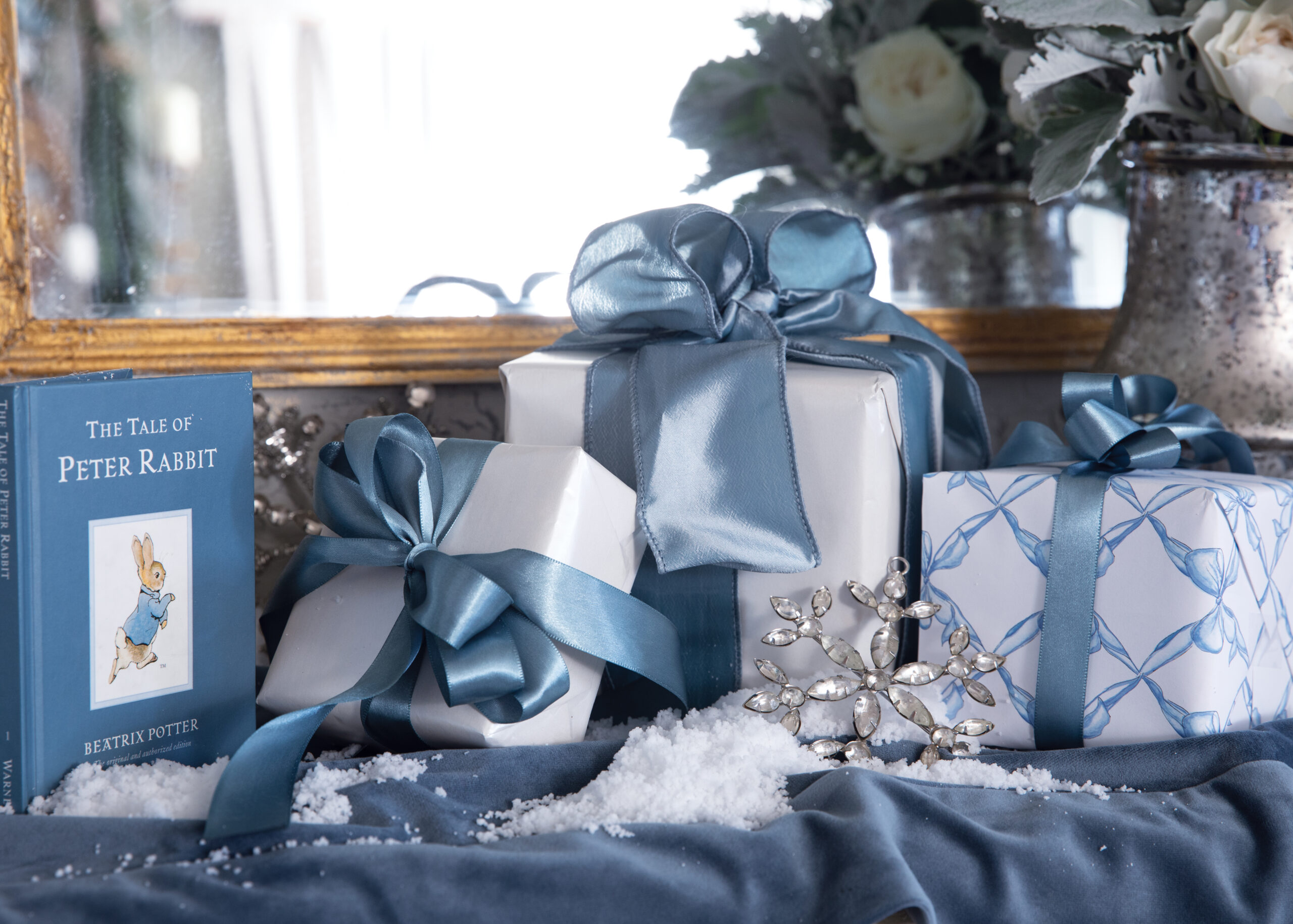 Blue wrapped gifts for baby shower