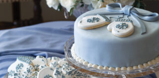 Blue wintry cake with white and blue snowflake cookies