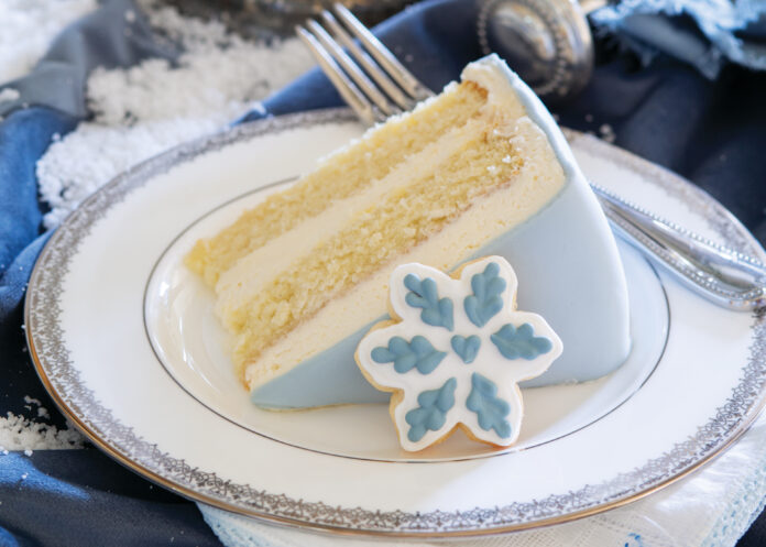 Slice of blue and white snowflake cake