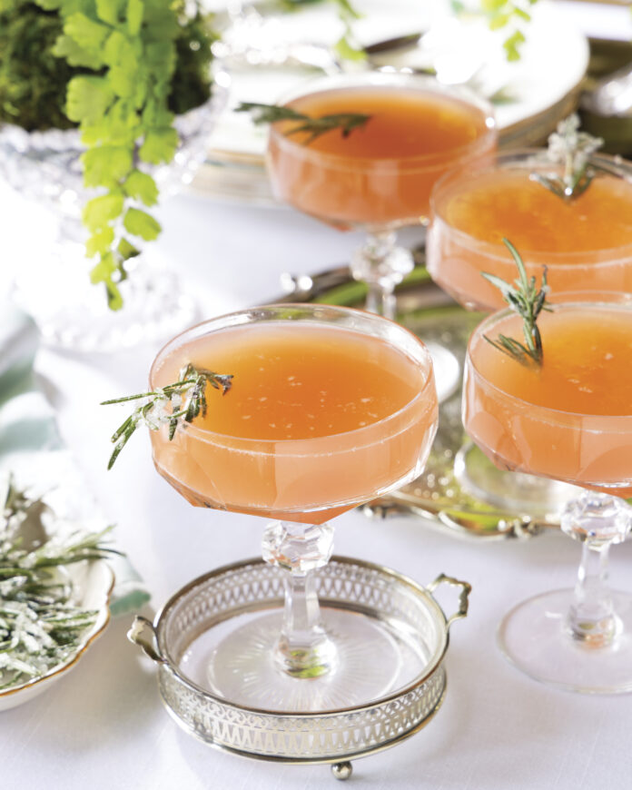 group of Grapefruit Rosemary Mimosas in coupe glasses