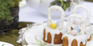 Lavender-Vanilla Mini Cakes, take on the appearance of baskets with fondant handles and toppings of lemon glaze, colorful candy eggs, and culinary lavender.