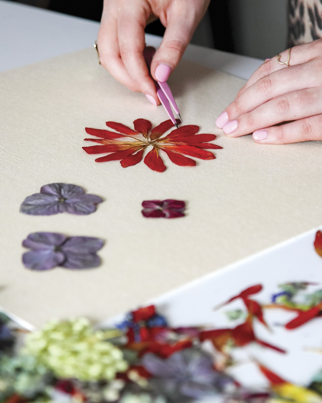artist arranging dried florals