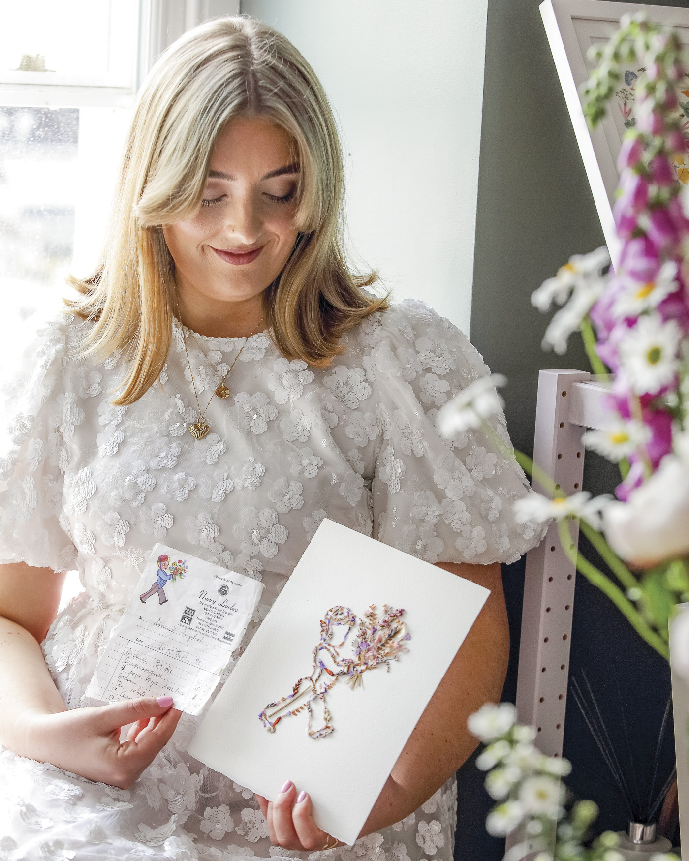 Nell holding her floral art