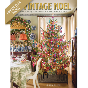 preorder-a-vintage-noel - Victoria Cover image for Vintage Noël: The Art of Creating Christmas Charm by Leben Riebe, featuring a richly decorated room with a colorful Christmas tree, china, and a table setting; preorder banner visible.