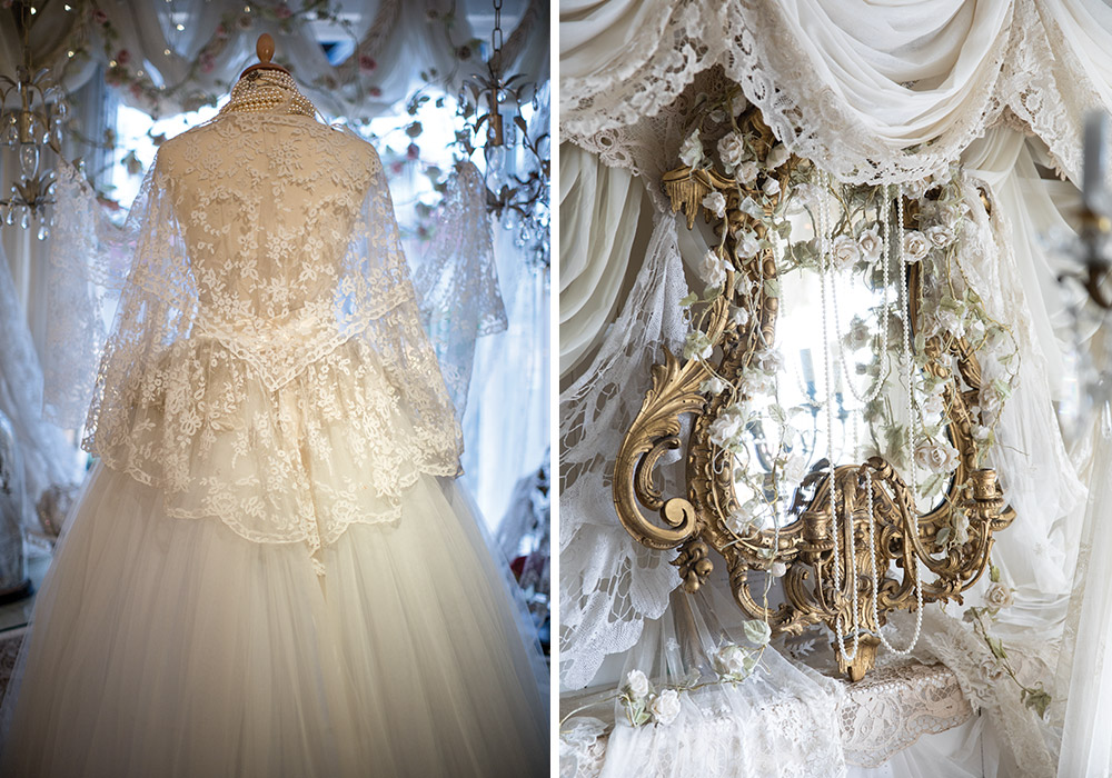 Left: A vintage-inspired wedding gown with intricate lace overlay and soft tulle skirt is displayed on a mannequin, surrounded by delicate fabrics and romantic décor. Right: An ornate gilded mirror is draped in layers of lace and adorned with trailing florals and strands of pearls, creating a dreamy, romantic vignette.
