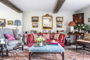 colorful cottage living room with pink and blue furnishings