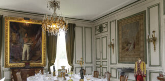 Gilded Refuge: Château de Valençay elegant dining with white tablecloth and chandelier