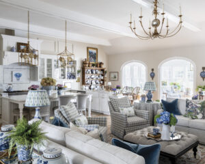 web_1 - Victoria living room with natural light streeming through, blue as an accent color and mixture of antiques and new pieces