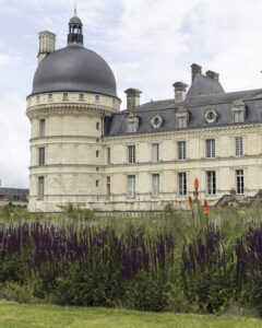 web_3 - Victoria exterior view of french chateau with some purple flowers
