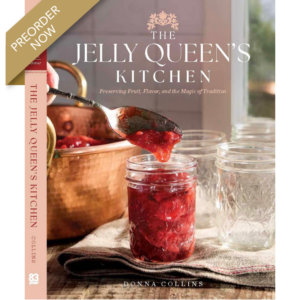 Book cover for The Jelly Queen's Kitchen with a jar of red jam being spooned, and a preorder banner across the corner.