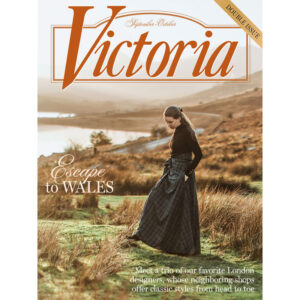 Victoria magazine cover featuring a woman in a long plaid dress walking in a hillside landscape with the 'Victoria' logo and 'Escape to WALES' headline.